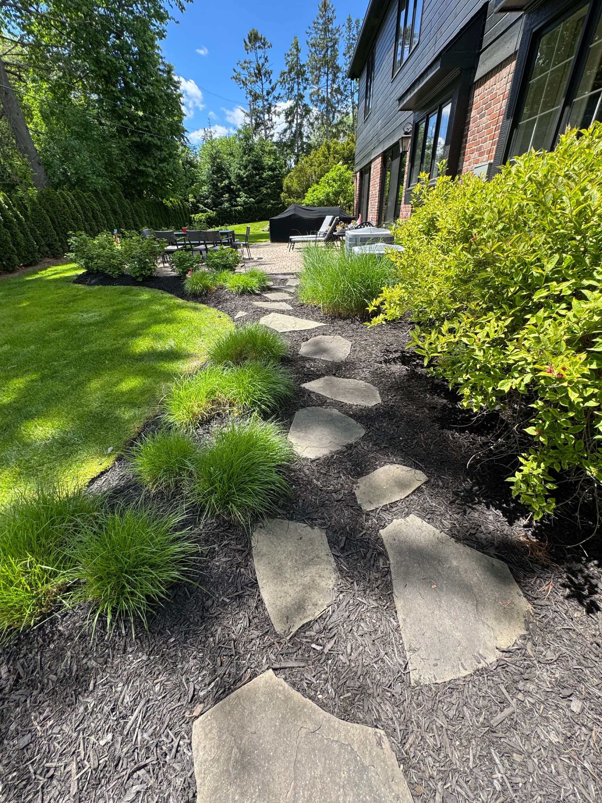 Custom outdoor patio and walkway installation in Macomb County Michigan by Tri-Point Landscaping